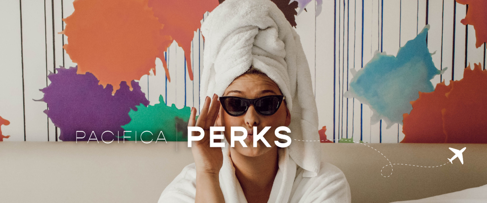 A person with a towel on their head and sunglasses, in front of a colorful splattered paint background with the text "PACIFICA PERKS" and an airplane icon.